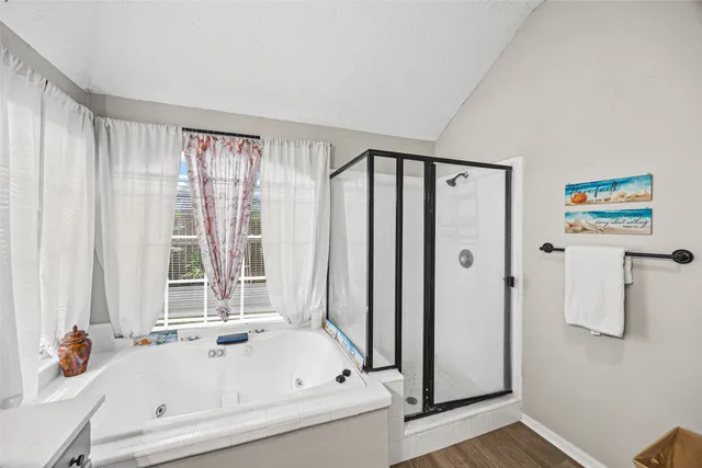 a bathroom with a tub and a shower