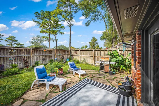 a view of a balcony with chairs and a table