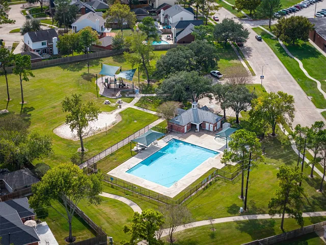 an aerial view of a pool patio swimming pool and outdoor seating