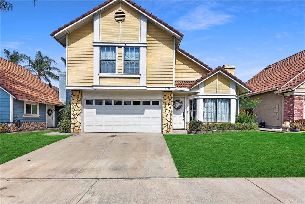 9798 Balaton Street Rancho Cucamonga, CA 91737 - Photo 1 of 1 a front view of a house with a yard and garage