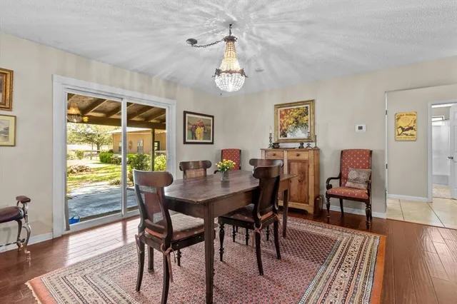 a kitchen with granite countertop a sink a counter top space appliances and cabinets
