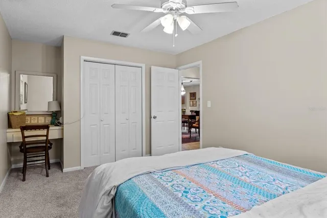 a bedroom with a bed and a table in it