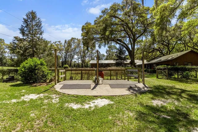 a view of outdoor space with wooden fence