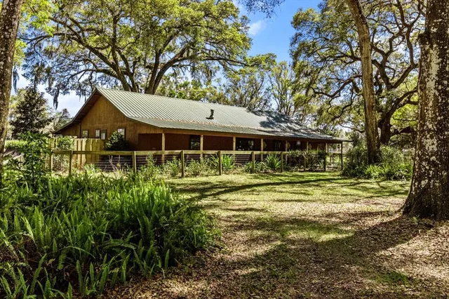 a view of yard with swimming pool and sitting area
