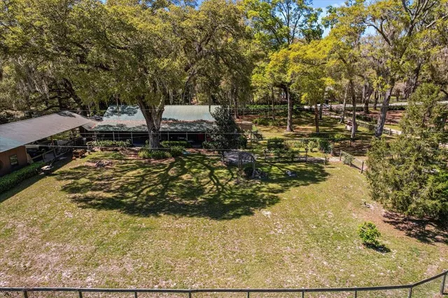 a view of yard with swimming pool