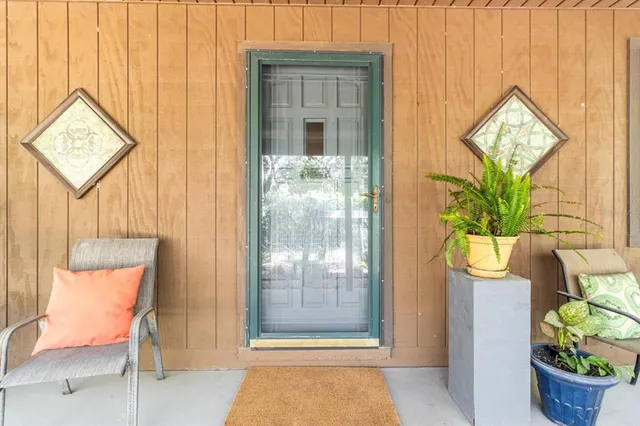a living room with furniture or wooden floor and a rug