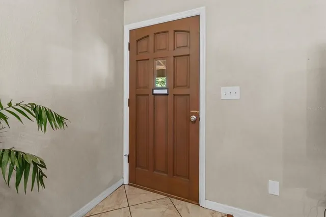 a living room with furniture fireplace and a window