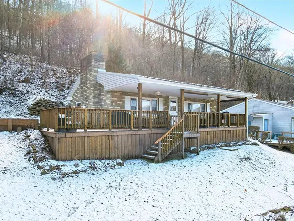 a view of a backyard with a patio