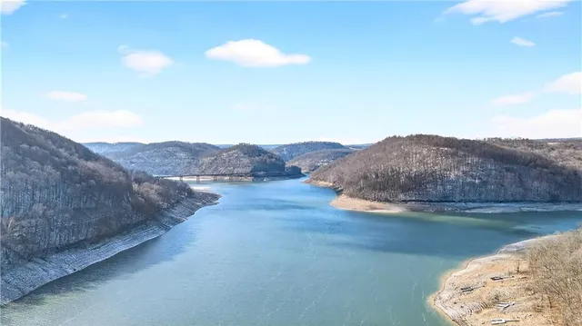 a view of a lake with mountains in the background