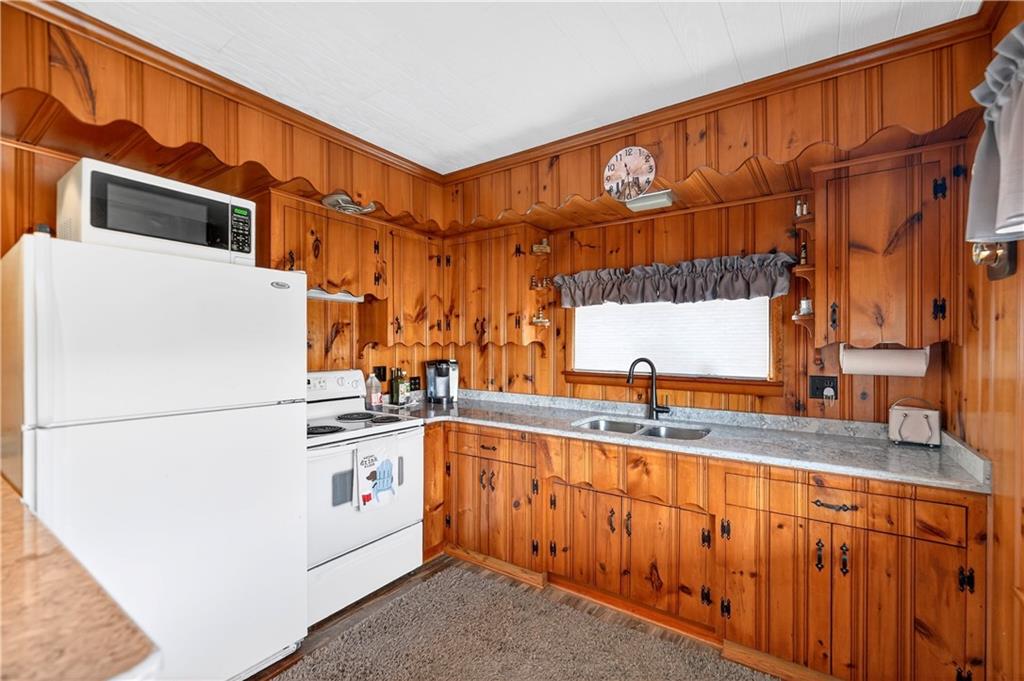 447 Lake Road Addison, PA 15411 - Photo 27 of 47 a kitchen with stainless steel appliances granite countertop a refrigerator and a sink