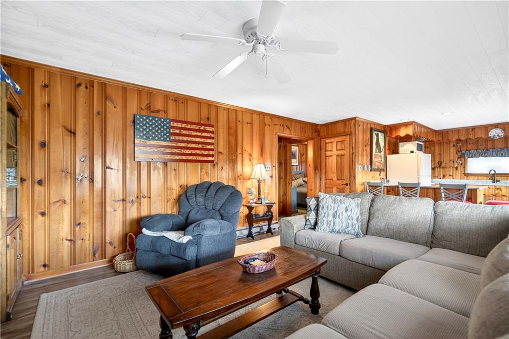 447 Lake Road Addison, PA 15411 - Photo 40 of 47 a living room with furniture a ceiling fan and a window