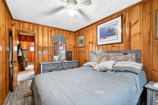 a bedroom with a bed and a chandelier