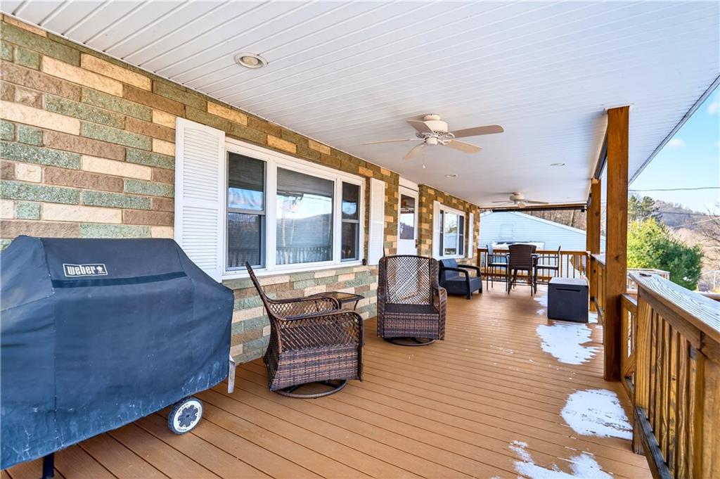 447 Lake Road Addison, PA 15411 - Photo 6 of 47 a living room filled with furniture hardwood floor and a table