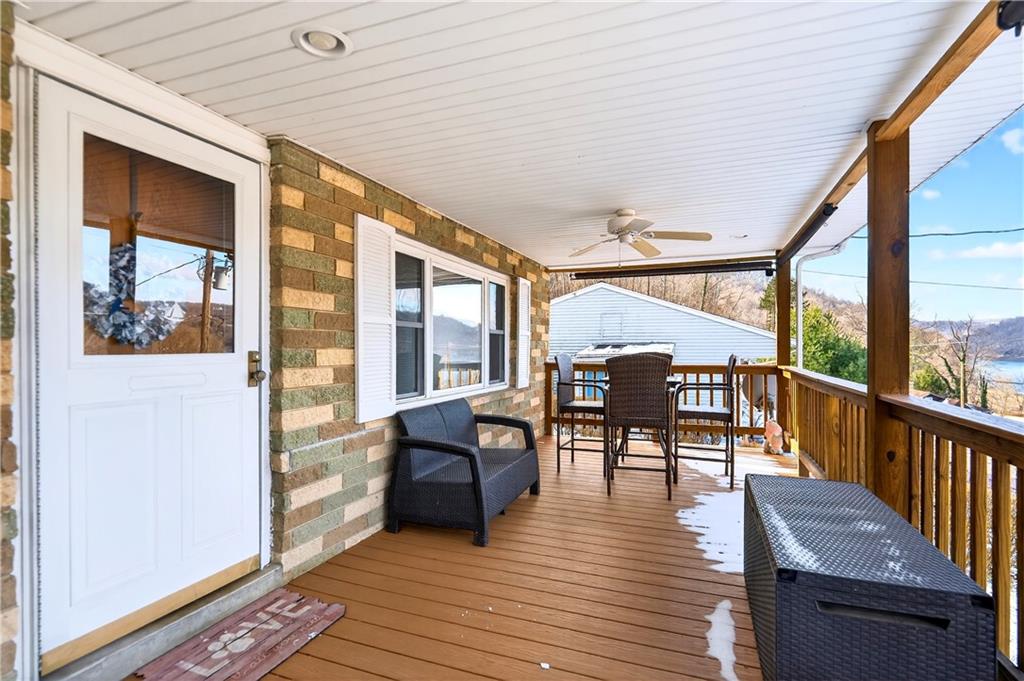447 Lake Road Addison, PA 15411 - Photo 7 of 47 a view of a patio with dining table and chairs