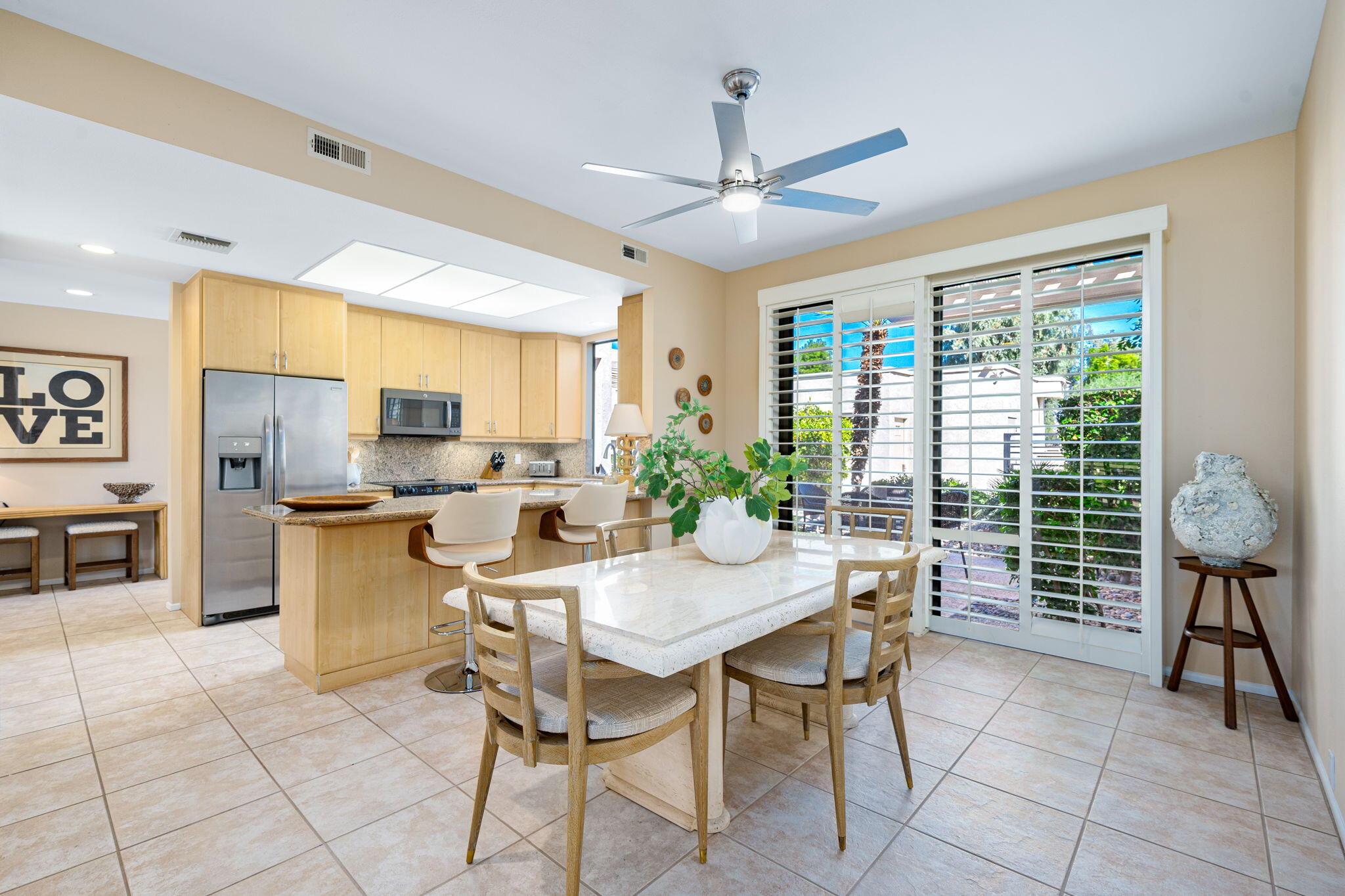 717 Inverness Drive Rancho Mirage, CA 92270 - Photo 11 of 46 a view of a dining room with furniture window and outside view