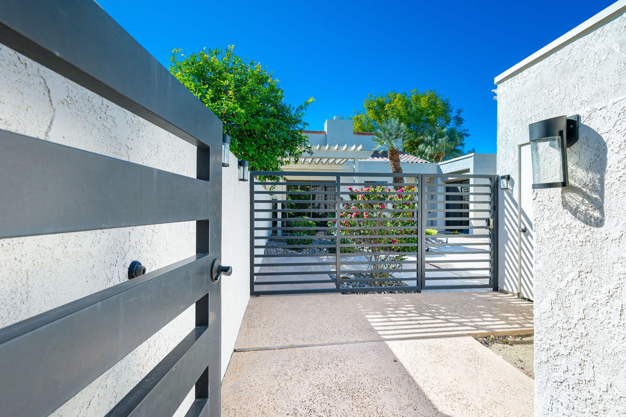 717 Inverness Drive Rancho Mirage, CA 92270 - Photo 2 of 46 a house view with a garden