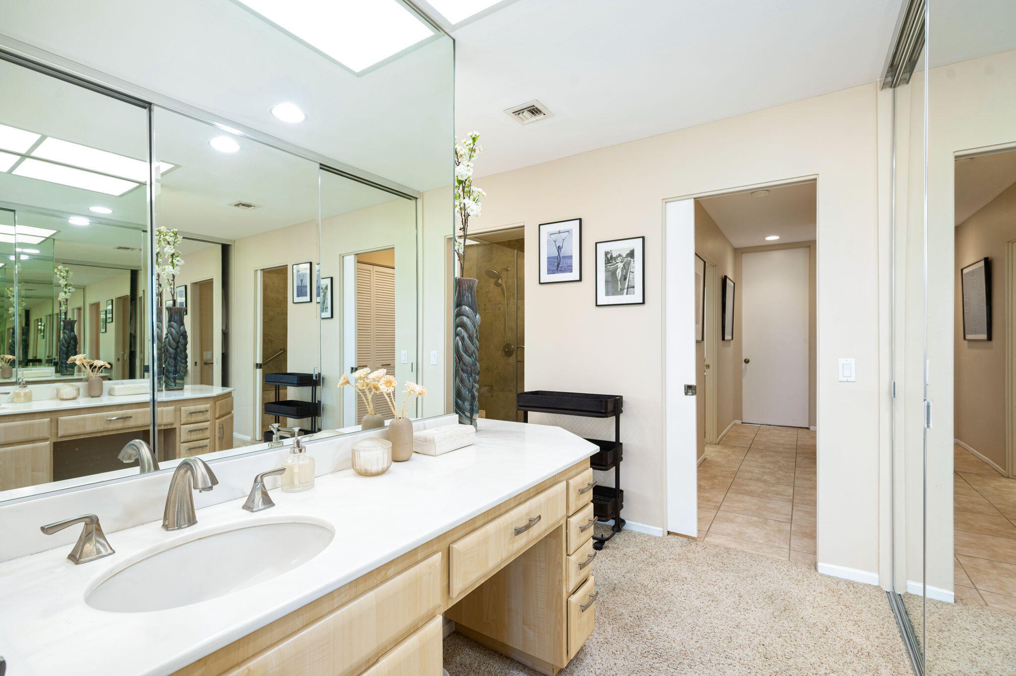 717 Inverness Drive Rancho Mirage, CA 92270 - Photo 22 of 46 a bathroom with a sink and a mirror