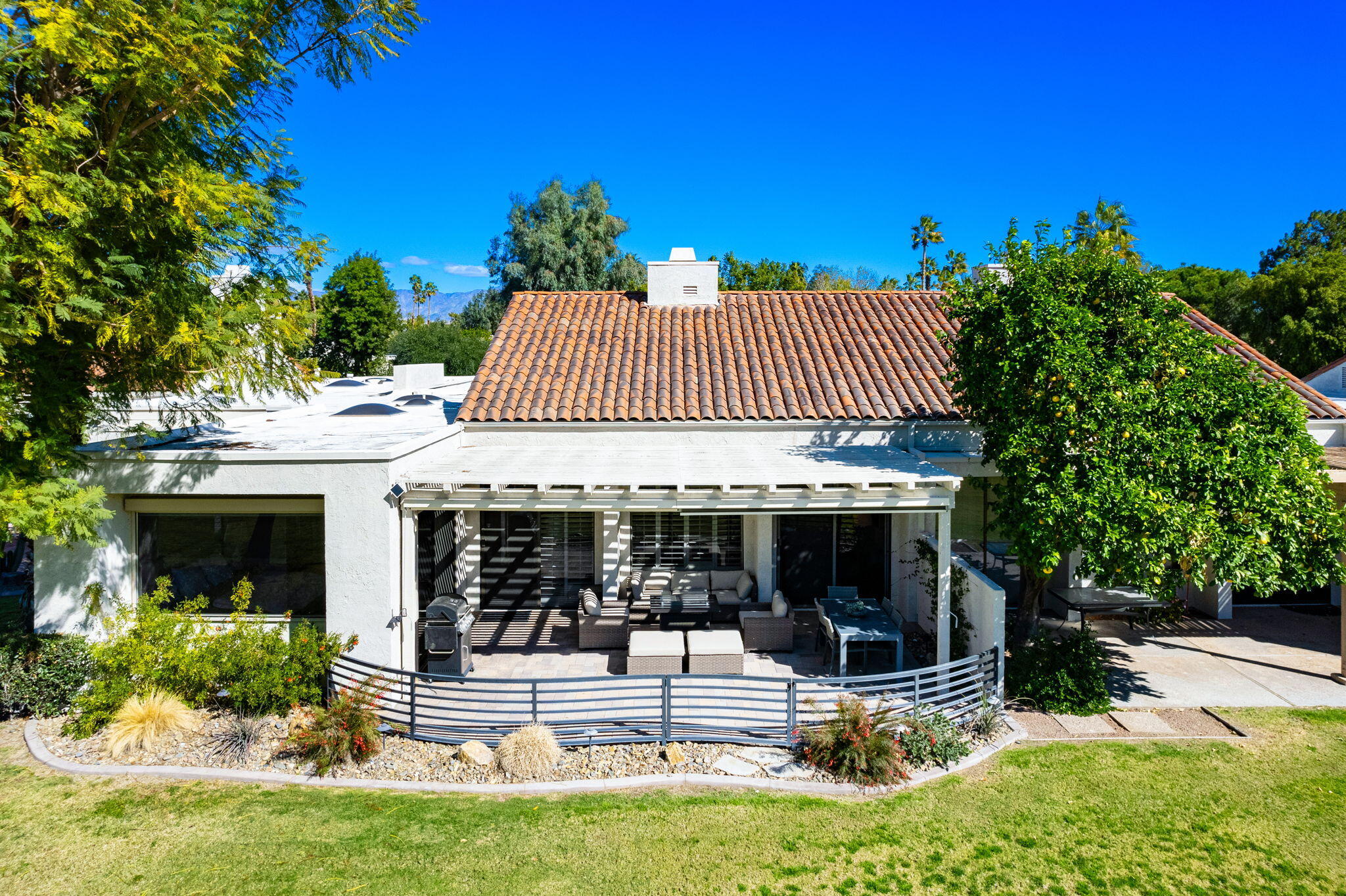 717 Inverness Drive Rancho Mirage, CA 92270 - Photo 28 of 46 front view of a house with a yard