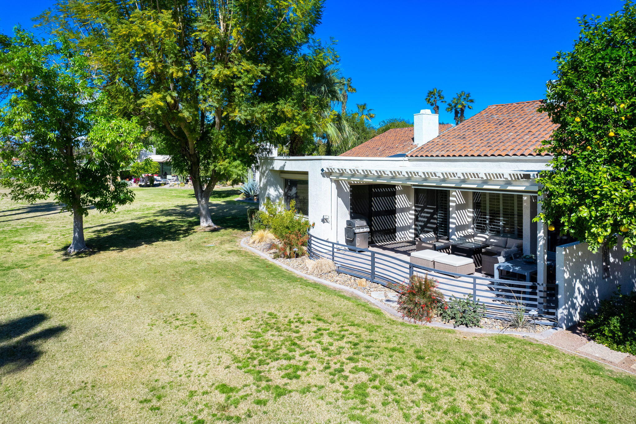 717 Inverness Drive Rancho Mirage, CA 92270 - Photo 29 of 46 a view of a house with backyard and sitting area