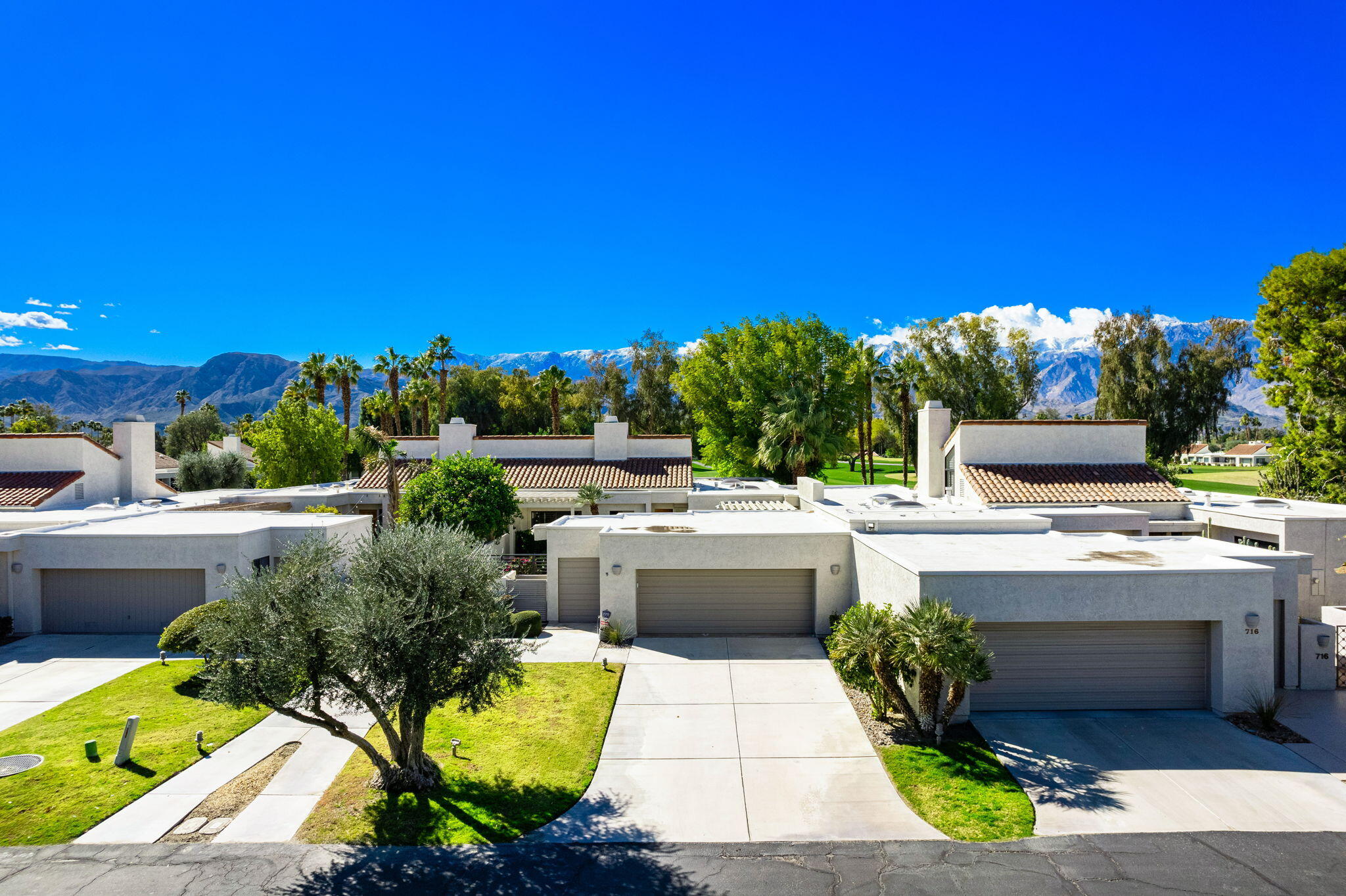 717 Inverness Drive Rancho Mirage, CA 92270 - Photo 31 of 46 a view of a swimming pool with a patio