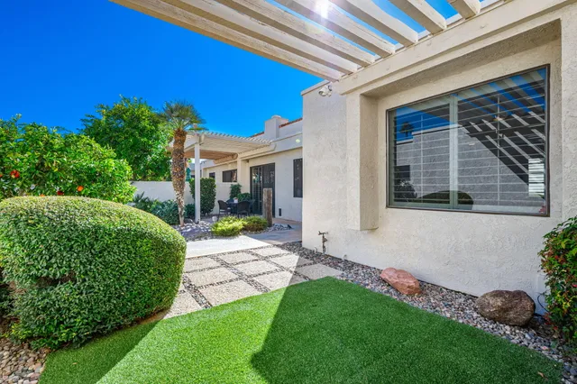a house with palm tree in the background