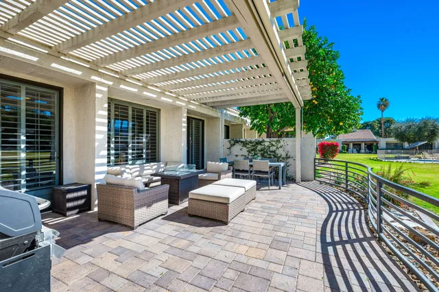a view of a patio with furniture