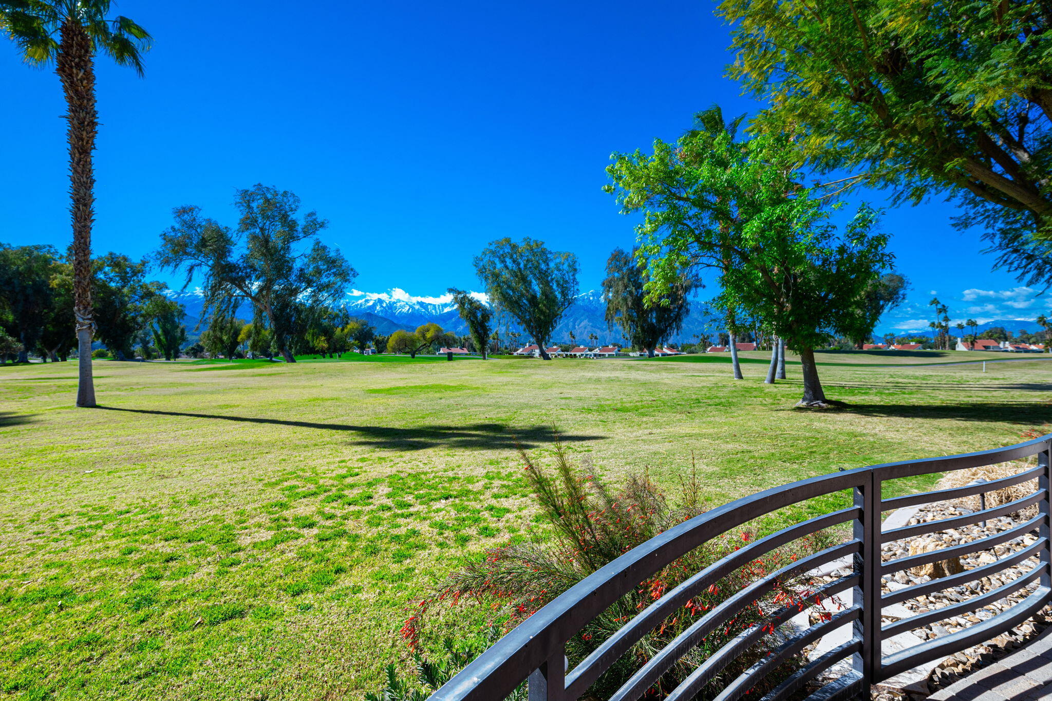 717 Inverness Drive Rancho Mirage, CA 92270 - Photo 42 of 46 a view of a golf course with a lake view