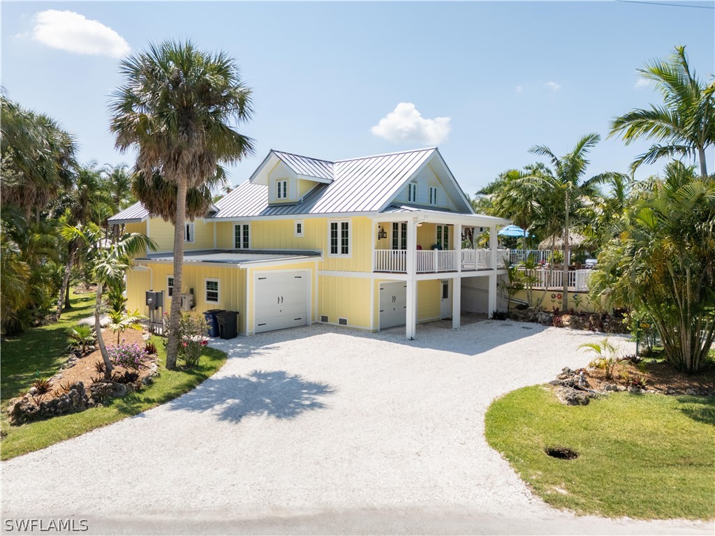 a house with palm tree in front of it