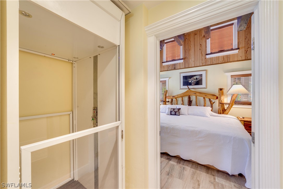 7146 Congdon Road Fort Myers, FL 33908 - Photo 12 of 50 a bedroom with a bed and a window with outer view
