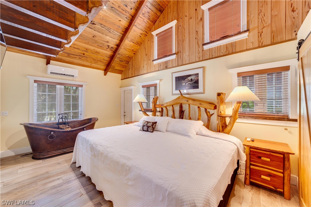7146 Congdon Road Fort Myers, FL 33908 - Photo 13 of 50 a bedroom with a bed and window