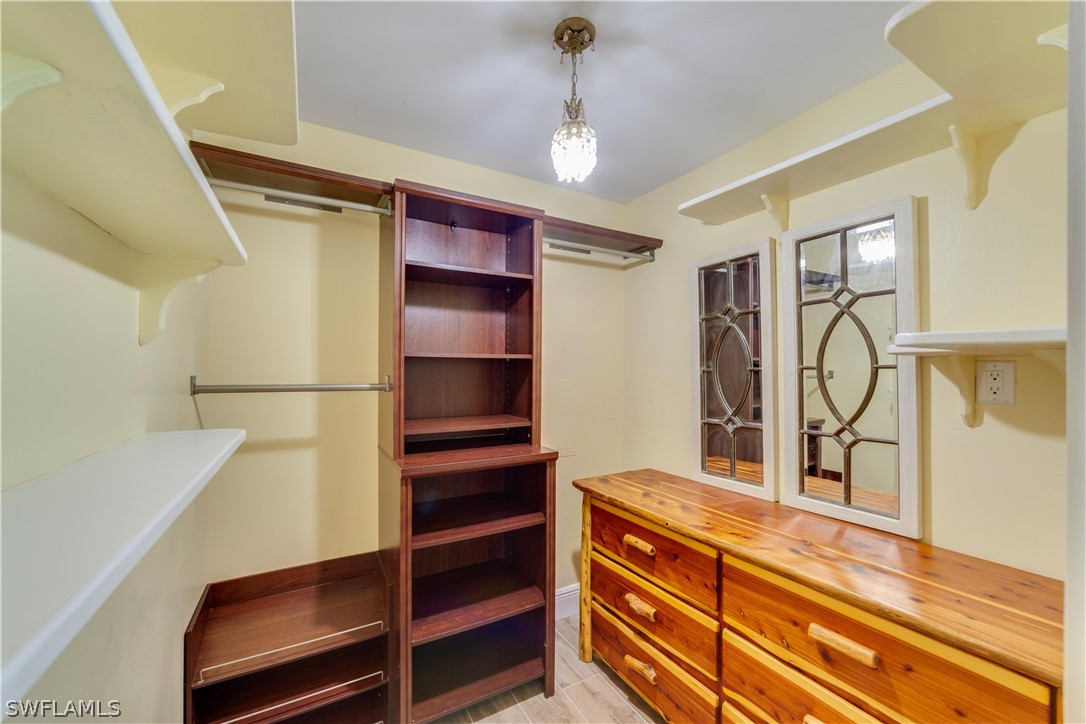 7146 Congdon Road Fort Myers, FL 33908 - Photo 19 of 50 a view of walk in closet with clothes and shoes