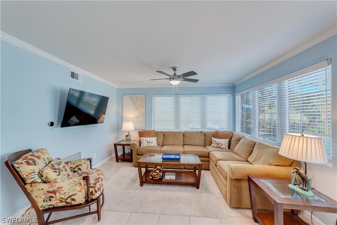 7146 Congdon Road Fort Myers, FL 33908 - Photo 27 of 50 a living room with furniture and a flat screen tv