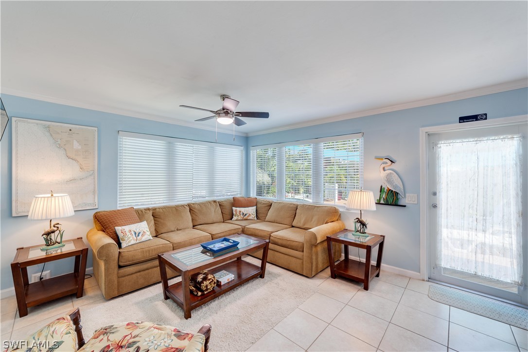 7146 Congdon Road Fort Myers, FL 33908 - Photo 29 of 50 a living room with furniture and a large window
