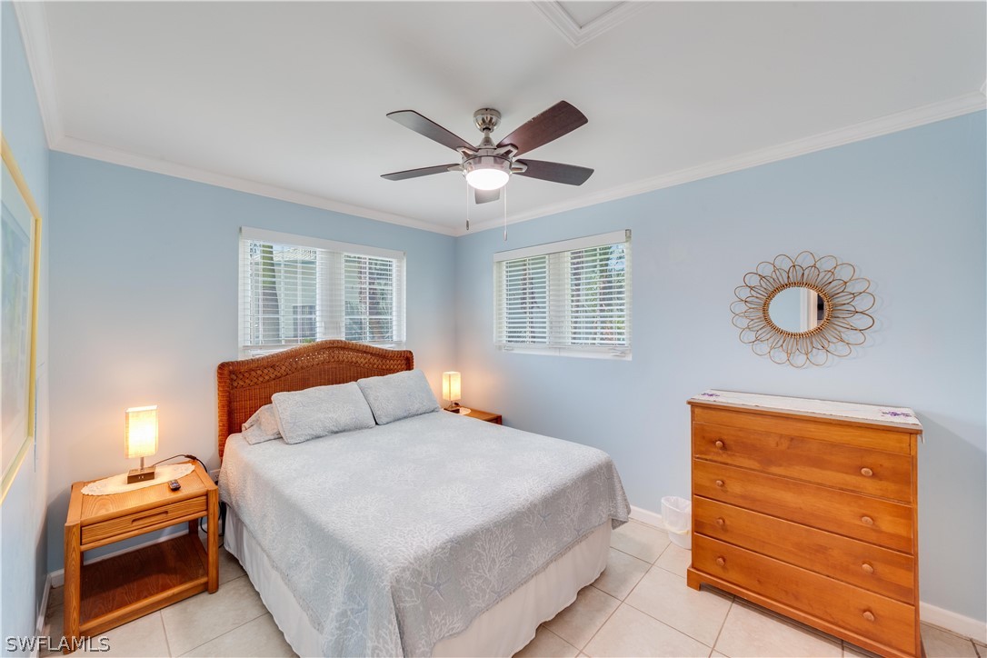 7146 Congdon Road Fort Myers, FL 33908 - Photo 30 of 50 a bedroom with a bed and window