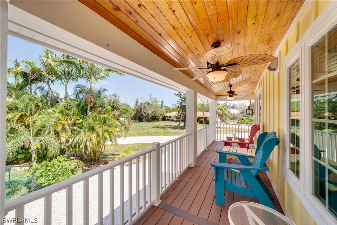 7146 Congdon Road Fort Myers, FL 33908 - Photo 3 of 50 a balcony with chairs and a table