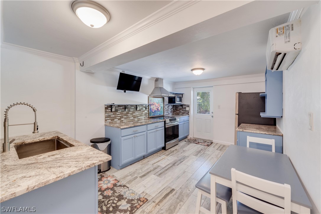 7146 Congdon Road Fort Myers, FL 33908 - Photo 34 of 50 a large kitchen with a stove a sink dishwasher and a refrigerator