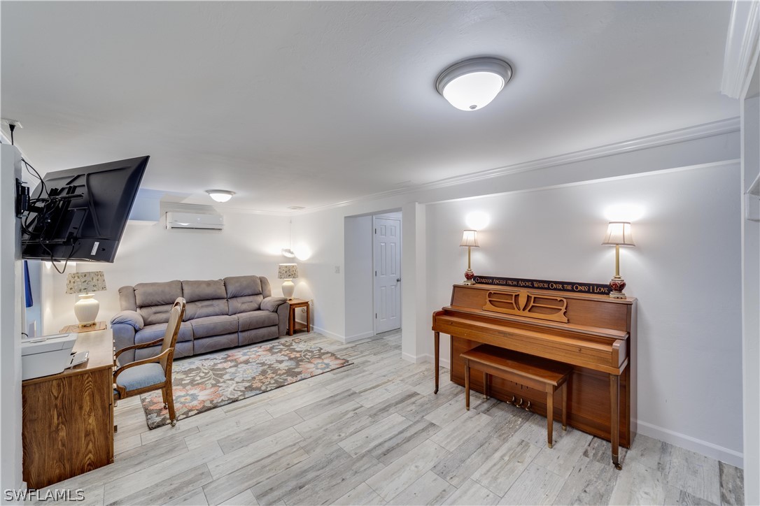 7146 Congdon Road Fort Myers, FL 33908 - Photo 35 of 50 a living room with furniture a wooden floor and a lamp