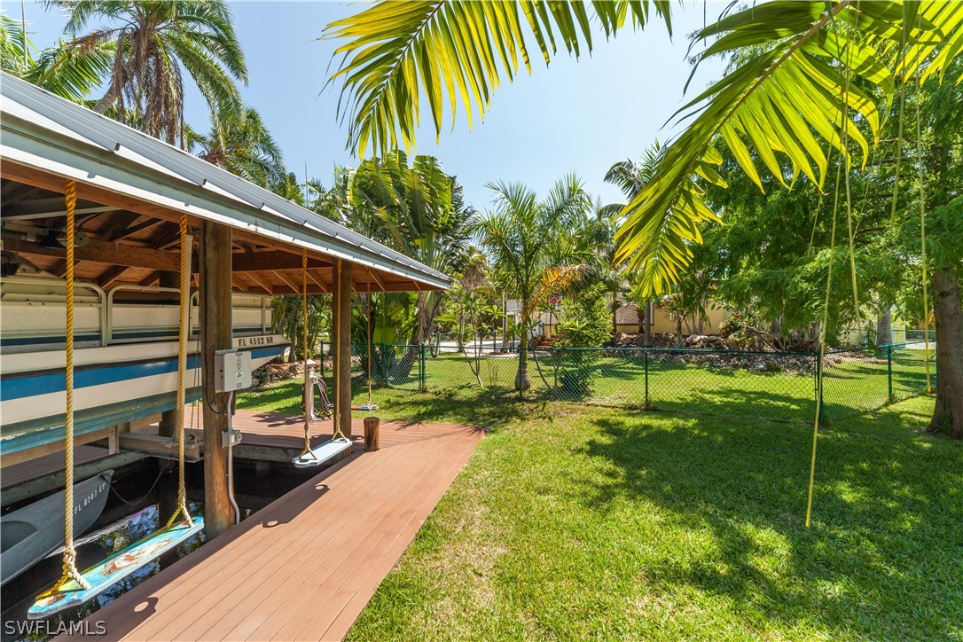 7146 Congdon Road Fort Myers, FL 33908 - Photo 38 of 50 a view of swimming pool with a patio and a yard