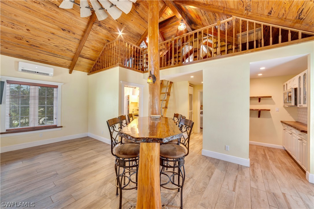 7146 Congdon Road Fort Myers, FL 33908 - Photo 9 of 50 a view of a dining room with furniture and wooden floor