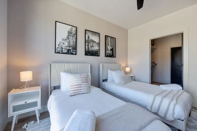 a bedroom with a bed and a lamp