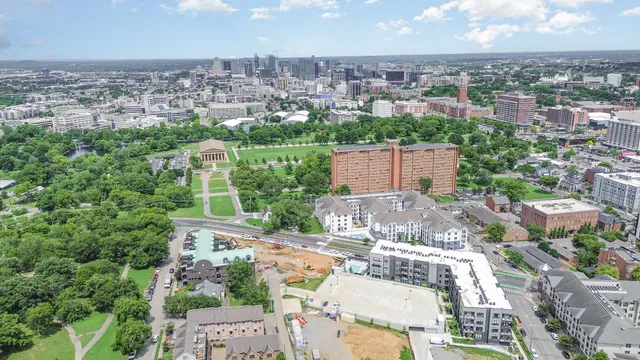 an aerial view of residential houses with city view
