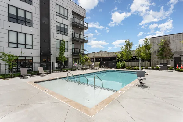 a view of a swimming pool with a lounge chairs