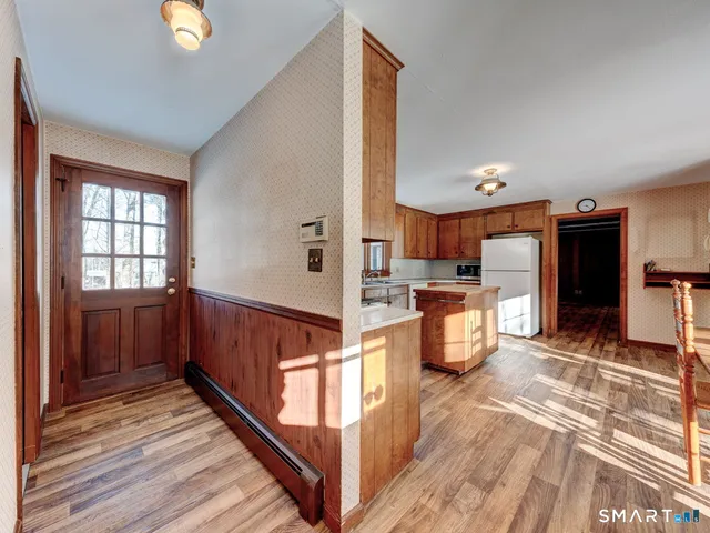 a view of a kitchen from the hallway