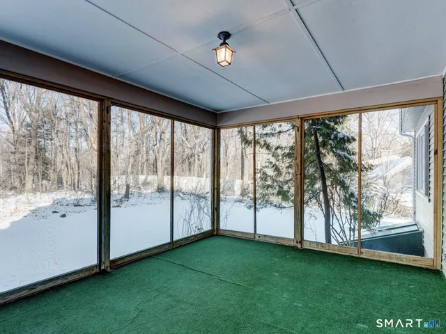 a view of an empty room with a large window