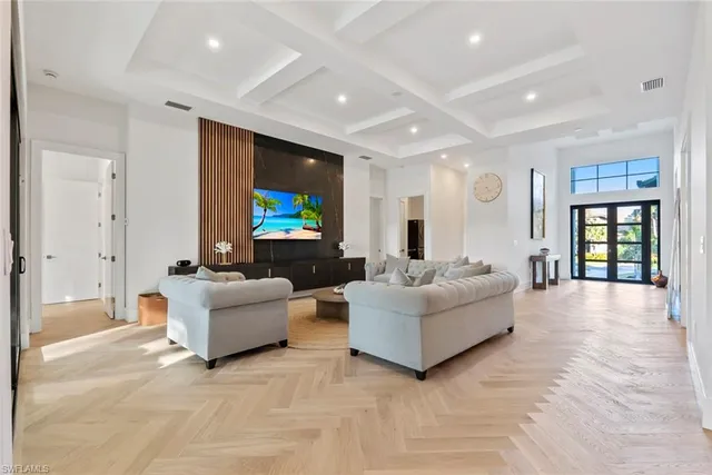 a living room with fireplace furniture and a flat screen tv