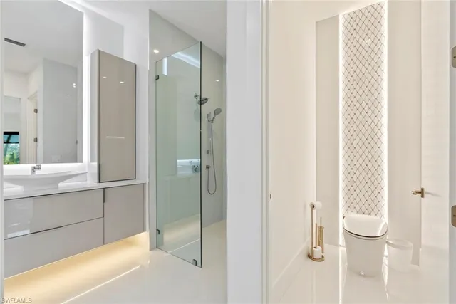 a bathroom with a shower and a sink