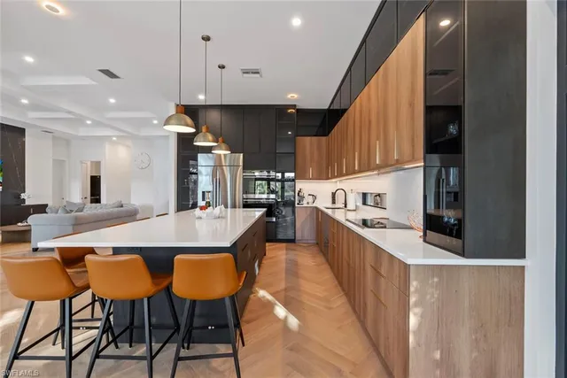 a large kitchen with a table and chairs