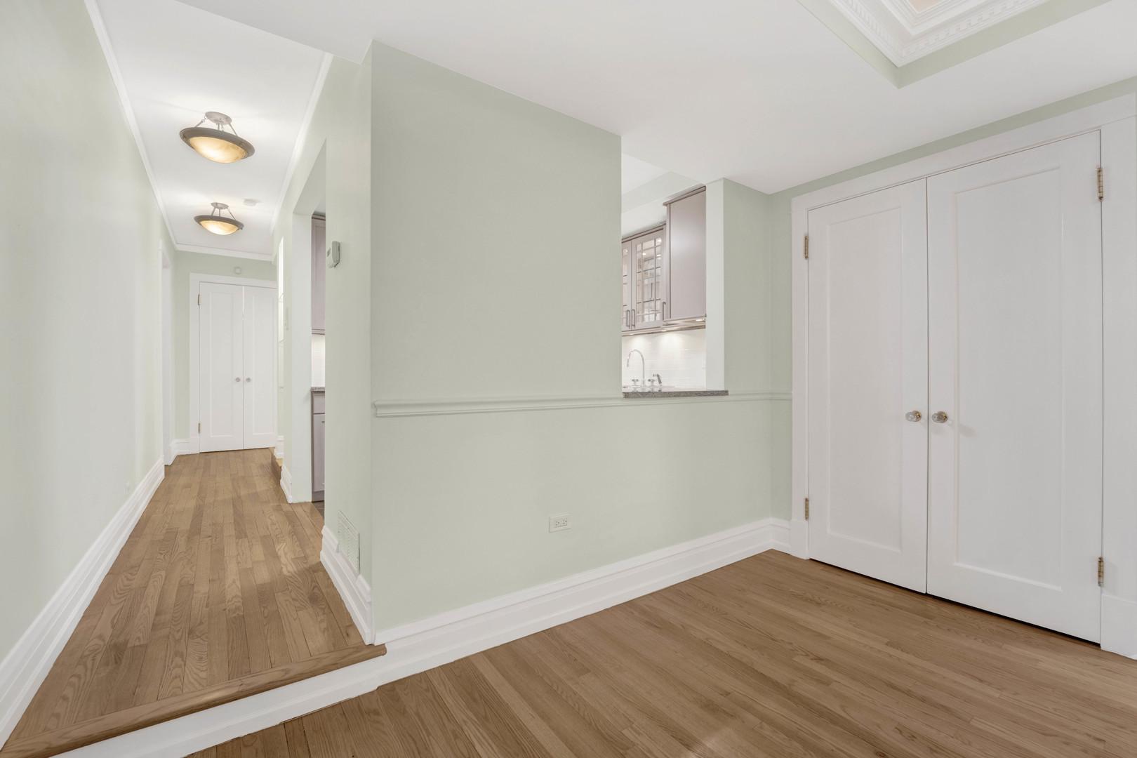 931 West Winona Street, Unit GDN Chicago, IL 60640 - Photo 11 of 18 an empty room with wooden floor and windows