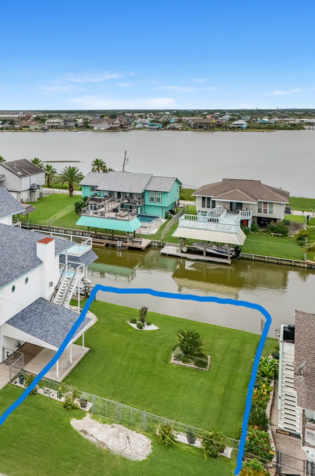 6 North Flamingo Street La Marque, TX 77568 - Photo 1 of 6 a view of a swimming pool and lake view
