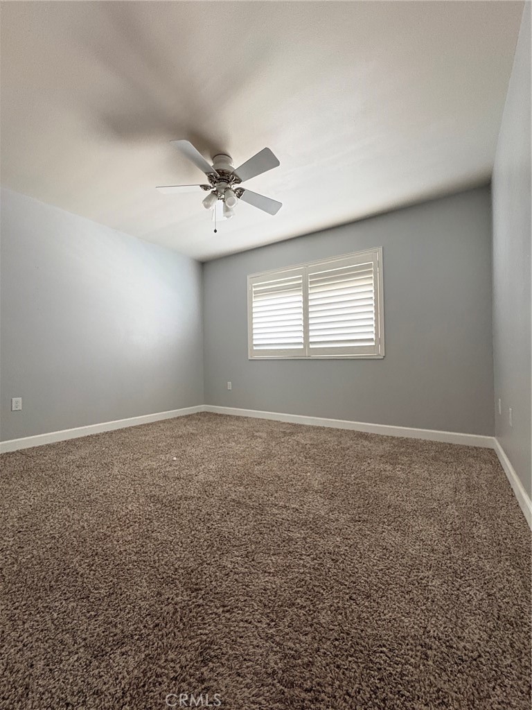 26378 Ridgemoor Road Menifee, CA 92586 - Photo 9 of 20 a view of a livingroom with a ceiling fan and window